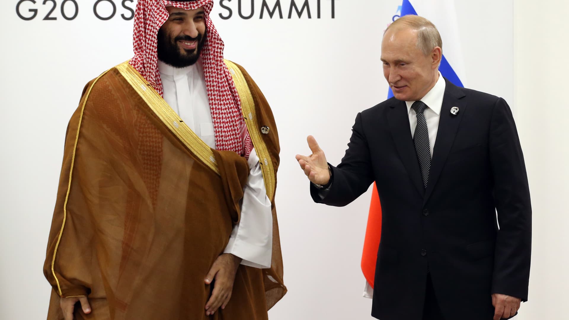Russian President Vladimir Putin (R) and Saudi Arabia's Prince and Defence Minister Mohammad bin Salman al Saud (L) attend bilateral talks at the G20 Osaka Summit 2019 on June 29, 2019.