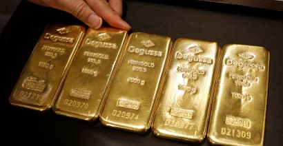 Gold slides on trimmed U.S. rate cut bets, rallying equities