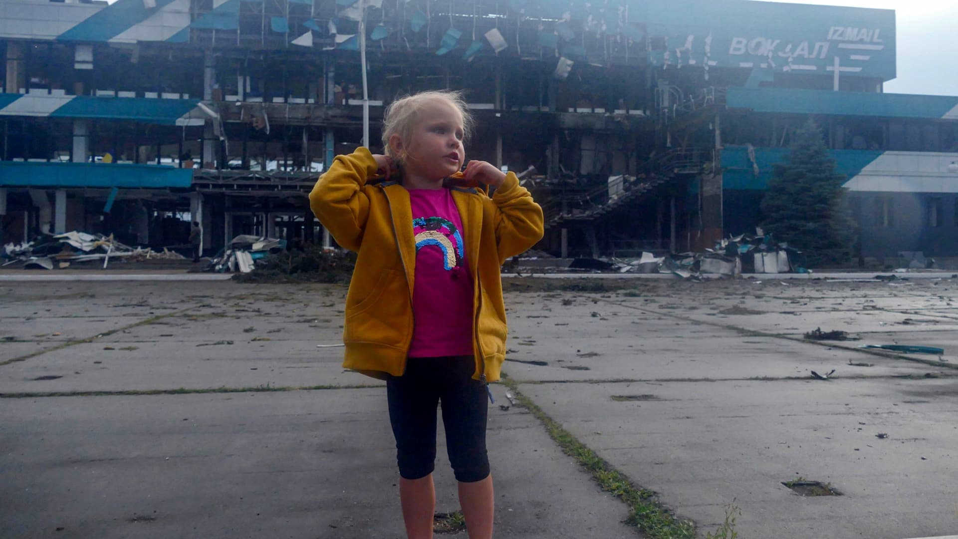 IZMAIL, UKRAINE - AUGUST 2, 2023 - A little girl is pictured during the building of the Marine Terminal damaged in the Russian drone attack on the port infrastructure of Izmail situated on the Danube River Wednesday night, August 2, Izmail, Odesa Region, southern Ukraine.NO USE RUSSIA. NO USE BELARUS. (Photo by Ukrinform/NurPhoto via Getty Images)