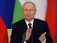 Russian President Vladimir Putin applauds at the Grand Kremlin Palace, on Nov. 21, 2023 in Moscow, Russia.