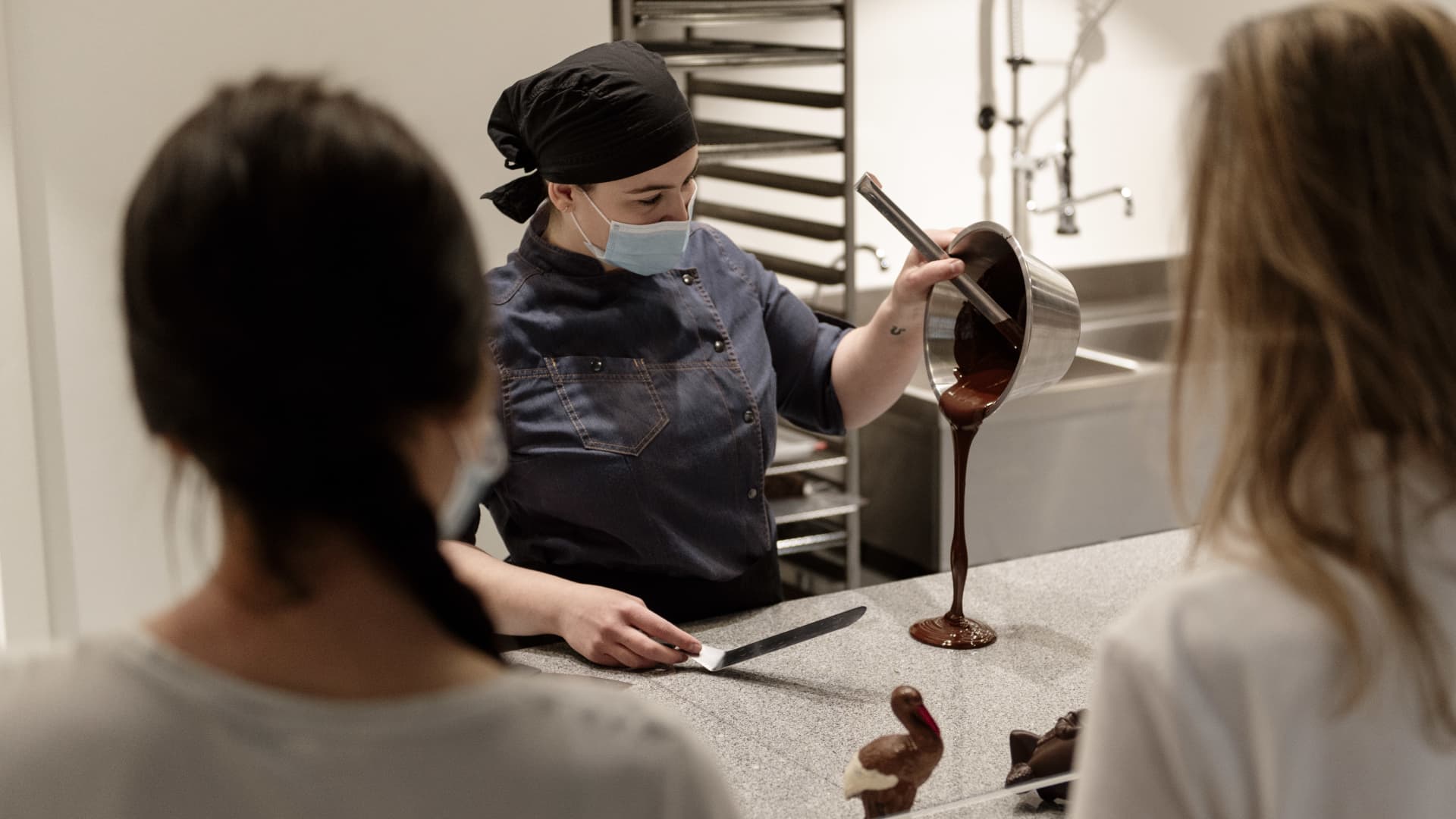 Guests watch as chocolate is poured at the Musée du Chocolat in Strasbourg, France.