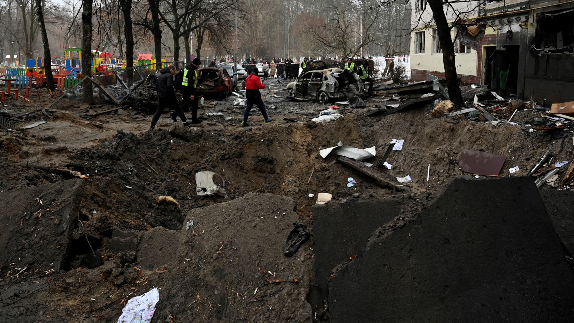 This photograph taken on December 13, 2023 shows a crater next to a residential building following a missile strike in Kyiv, amid Russian invasion of Ukraine. (Photo by SERGEI CHUZAVKOV / AFP) (Photo by SERGEI CHUZAVKOV/AFP via Getty Images)