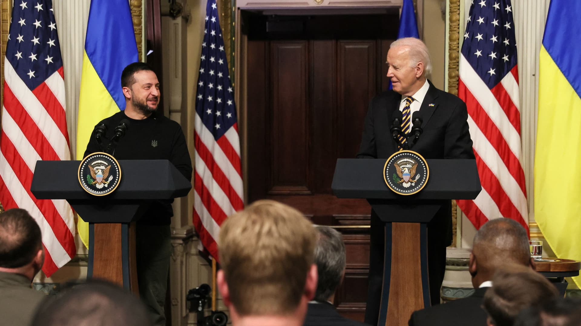 U.S. President Joe Biden and Ukraine's President Volodymyr Zelenskiy react during a joint press conference at the White House in Washington, U.S., December 12, 2023. 