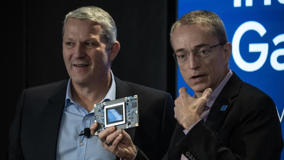 Patrick Gelsinger, chief executive officer of Intel Corp., right, holds an Intel Gaudi3 AI accelerator as he speaks alongside Christoph Schell, chief commercial officer on Intel Corp., during the Intel AI Everywhere launch event in New York, US, on Thursday, Dec. 14, 2023. Intel Corp. announced new chips for PCs and data centers that the company hopes will give it a bigger slice of the booming market for artificial intelligence hardware. Photographer: Victor J. Blue/Bloomberg via Getty Images