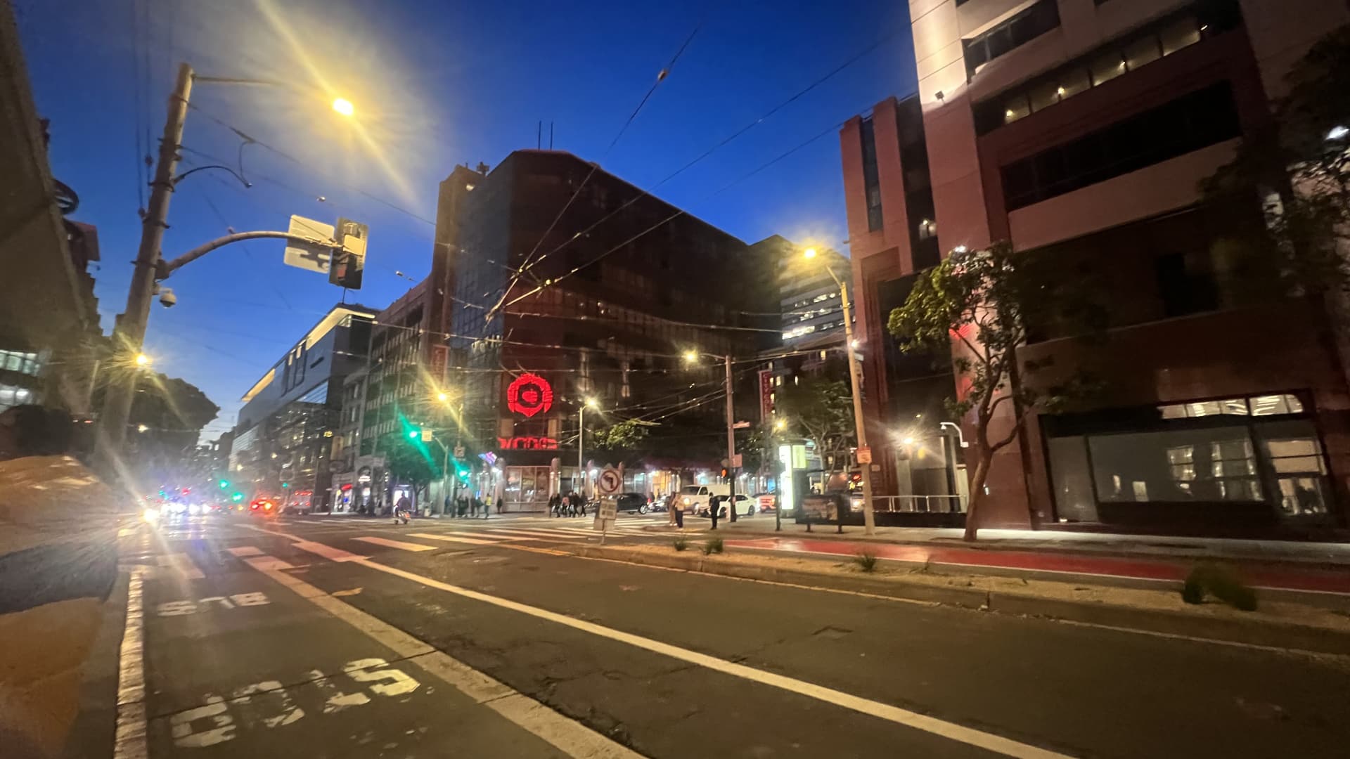 The Target sign from its Mission Street store in San Francisco's Union Square glows on a building across the street, November 2023.