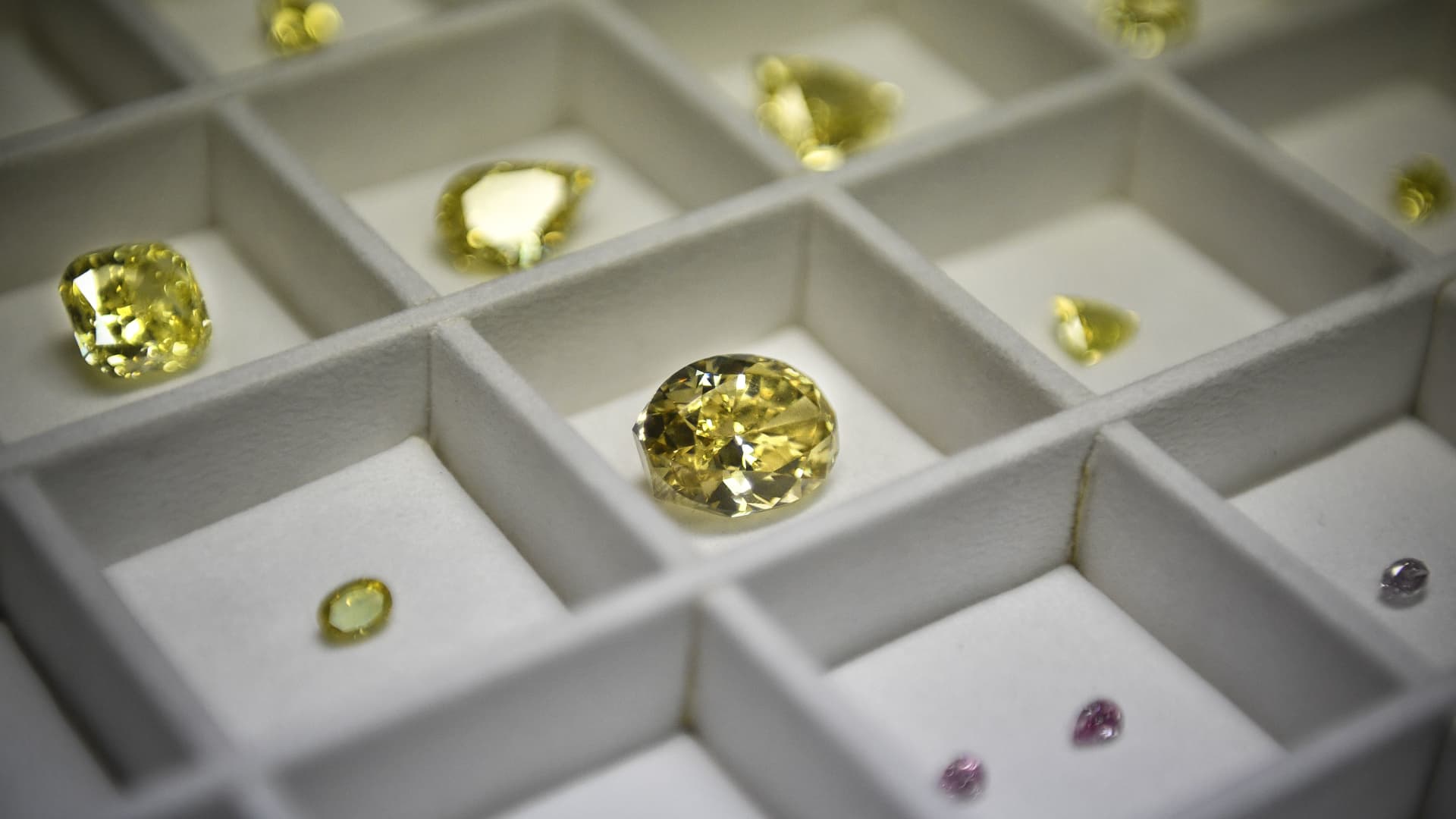 A display of diamonds shows coloured diamonds among other stones at Alrosa Diamond Cutting Division in Moscow on July 3, 2019.