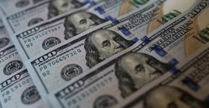 Dollar eases as safety bid fades; traders eye Friday's U.S. inflation report