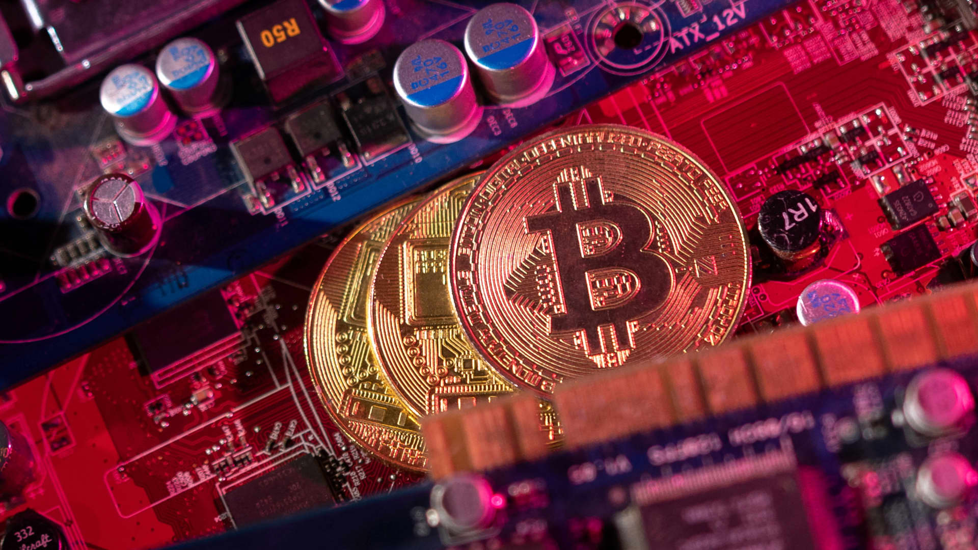 Representations of cryptocurrency Bitcoin are placed on a PC motherboard in this illustration taken June 16, 2023. 