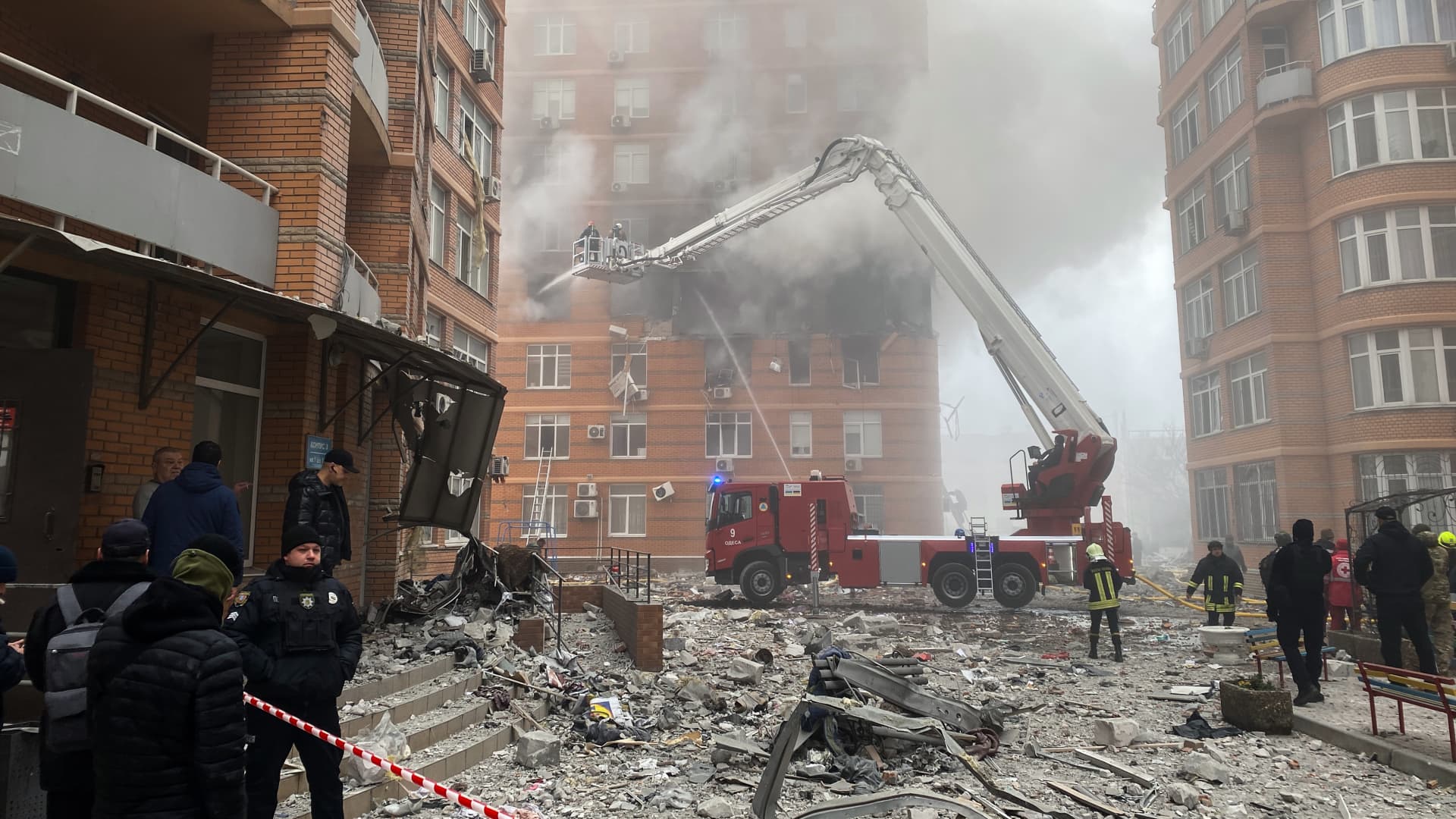 Medics and a firefighters work at the site of a damaged apartment building on Skisna Street after a Russian missile attack on December 29, 2023 in Odesa, Ukraine. 