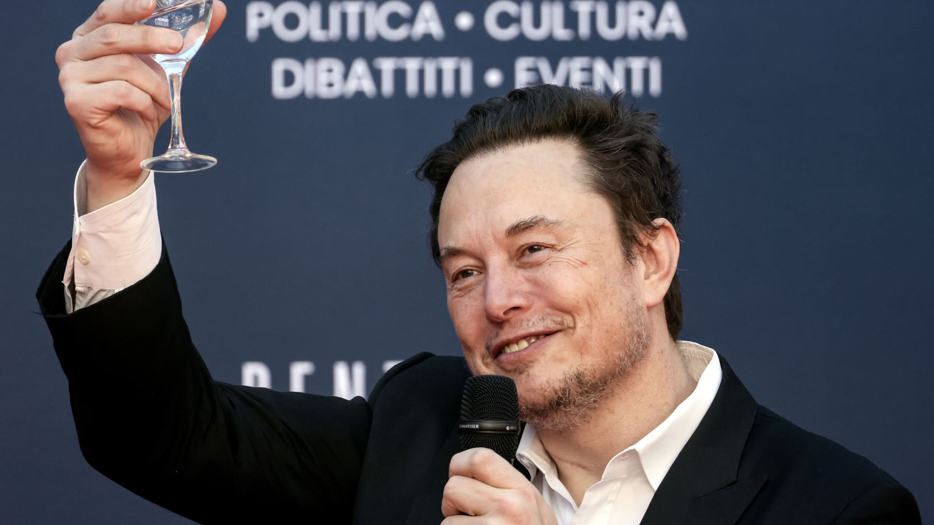 Elon Musk, chief executive officer of Tesla Inc., raises a glass at the Atreju convention in Rome, Italy, on Saturday, Dec. 16, 2023. The annual event, organized by Giorgia Meloni's Brothers of Italy party, began in 1998 as a convention for right-wing youths and has evolved into a political kermesse, including ministers and members of the opposition. Photographer: Alessia Pierdomenico/Bloomberg via Getty Images