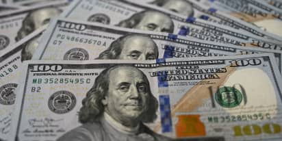Dollar a tad softer as markets wait for Fed