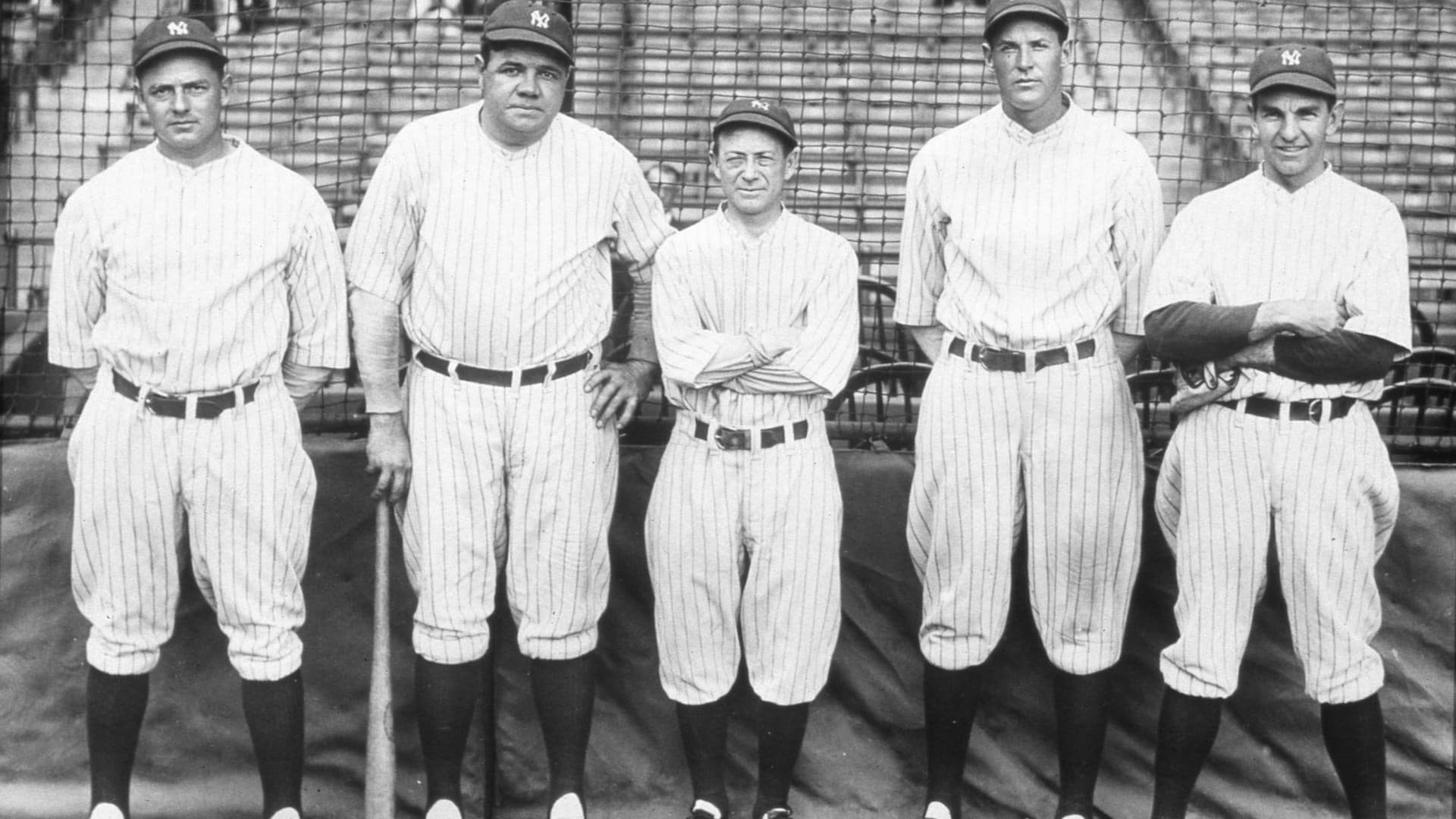 (L-R) Waite Hoyt, Babe Ruth, Huggins, Miller Huggins, Bob Meusel, and Bob Shawkey pose for a photo at Yankee Stadium in New York City in 1927.
