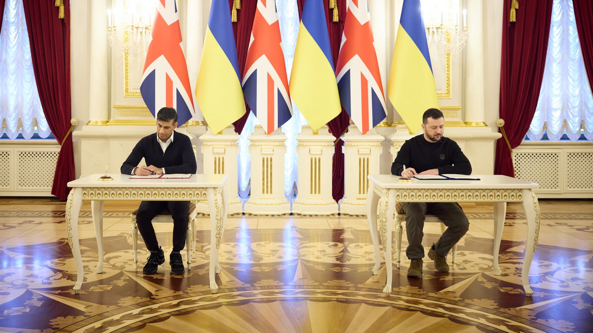 British Prime Minister Rishi Sunak (L) and Ukrainian President Volodymyr Zelenskyy (R) hold bilateral talks as UK premier unveils $3.1B military aid package for Ukraine amid their meeting in Ukraine's capital Kyiv on January 12, 2024.