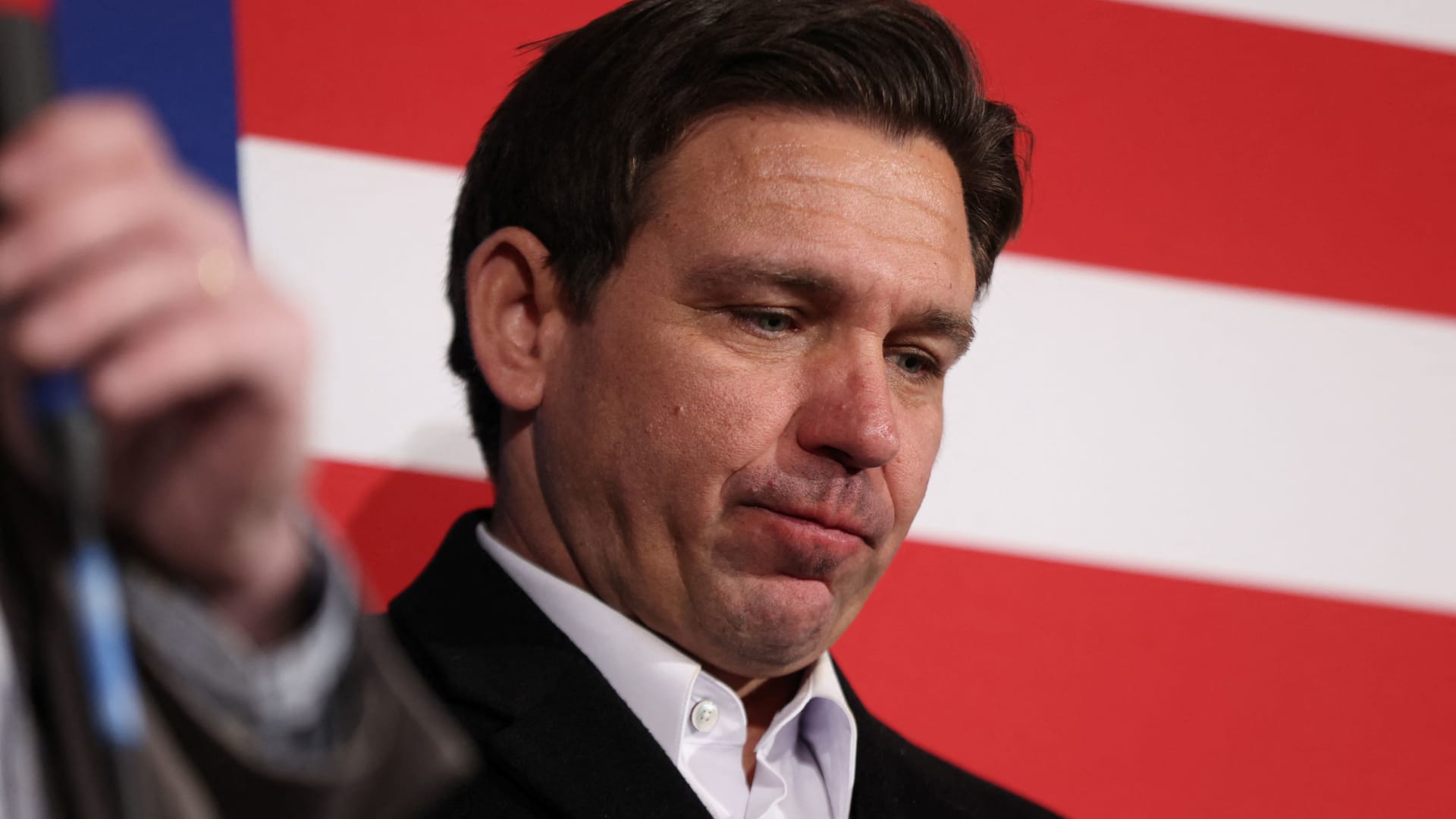 Republican presidential candidate and Florida Governor Ron DeSantis looks on during a campaign event at the Chrome Horse Saloon ahead of the caucus vote in Cedar Rapids, Iowa, U.S., January 14, 2024. 