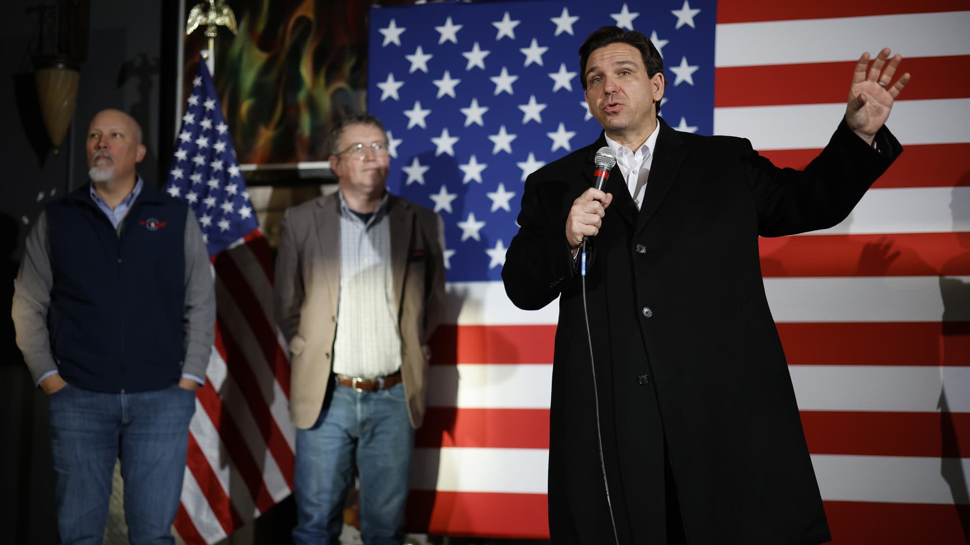 Republican presidential candidate Florida Gov. Ron DeSantis (R) is joined on stage by Rep. Chip Roy (R-TX) (L) and Rep. Thomas Massie (R-KY) (2nd-L) during a campaign event at the Chrome Horse Saloon one day before the Iowa caucuses on January 14, 2024 in Cedar Rapids, Iowa.