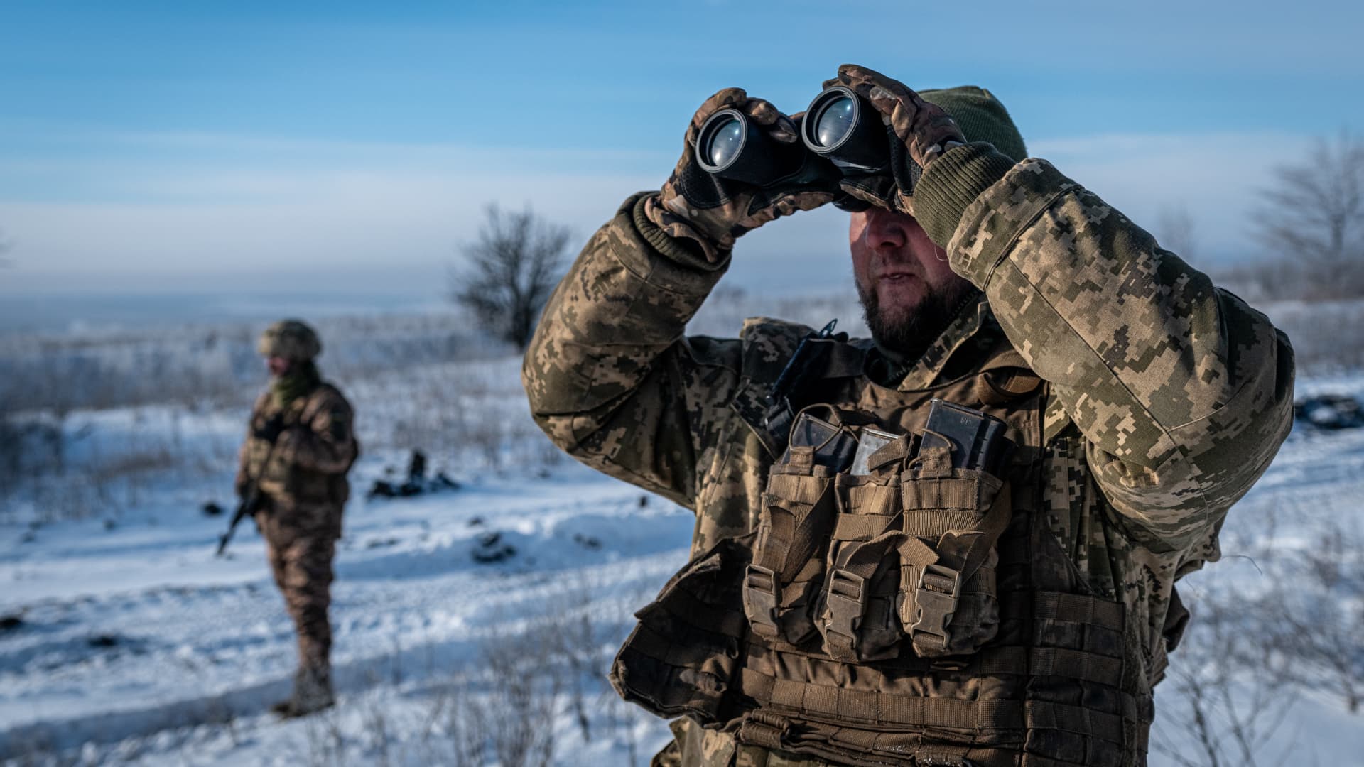 Ukrainian soldiers look at the sky in search for a nearby Russian drone at the Bakhmut frontline, in Donetsk Oblast, Ukraine on January 13, 2024.