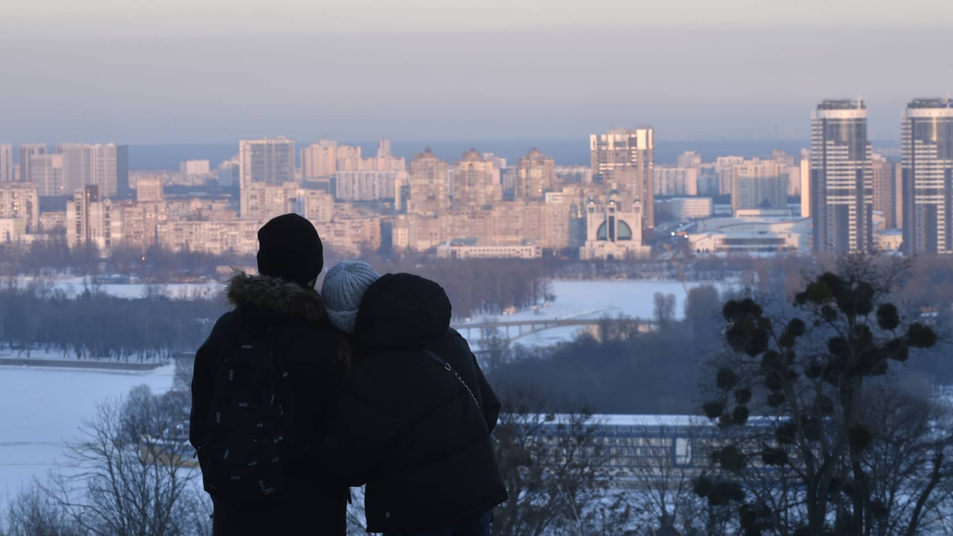 KYIV, UKRAINE - 2024/01/17: A couple seen looking out at the city of Kyiv. (Photo by Sergei Chuzavkov/SOPA Images/LightRocket via Getty Images)