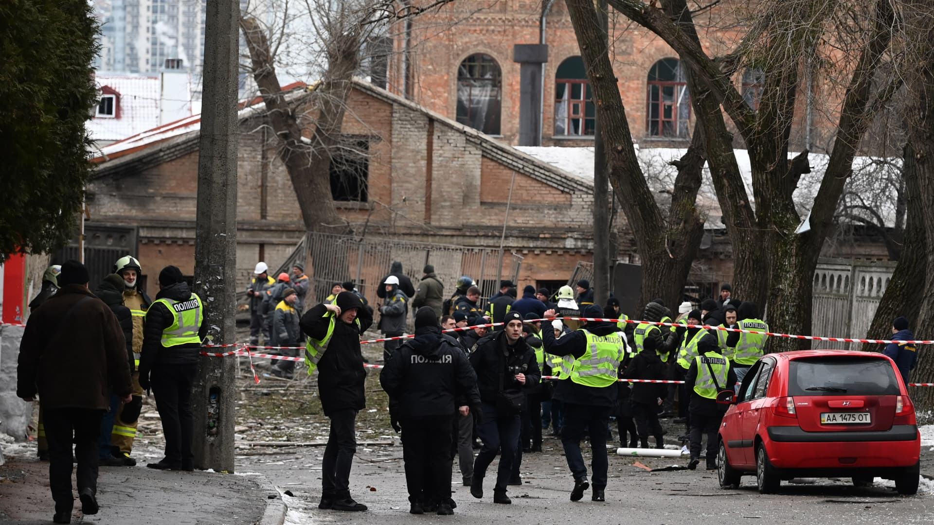 KYIV, UKRAINE - JANUARY 23: Police cordon nearby areas off the damaged buildings after Russian rocket strikes as Russia-Ukraine war continues in Kyiv, Ukraine on January 23, 2024. Russian missile attack targeted the Ukrainian cities of Kyiv, Kharkiv, Pavlohrad, and Balakliia on Tuesday, Jan. 23, killing at least 4 people, wounding several others, and damaging residential buildings. According to an official, nine people were injured in the capital of Kyiv, while 3 people died and 28 people were injured in the attack in Kharkiv. (Photo by Vladimir Shtanko/Anadolu via Getty Images)