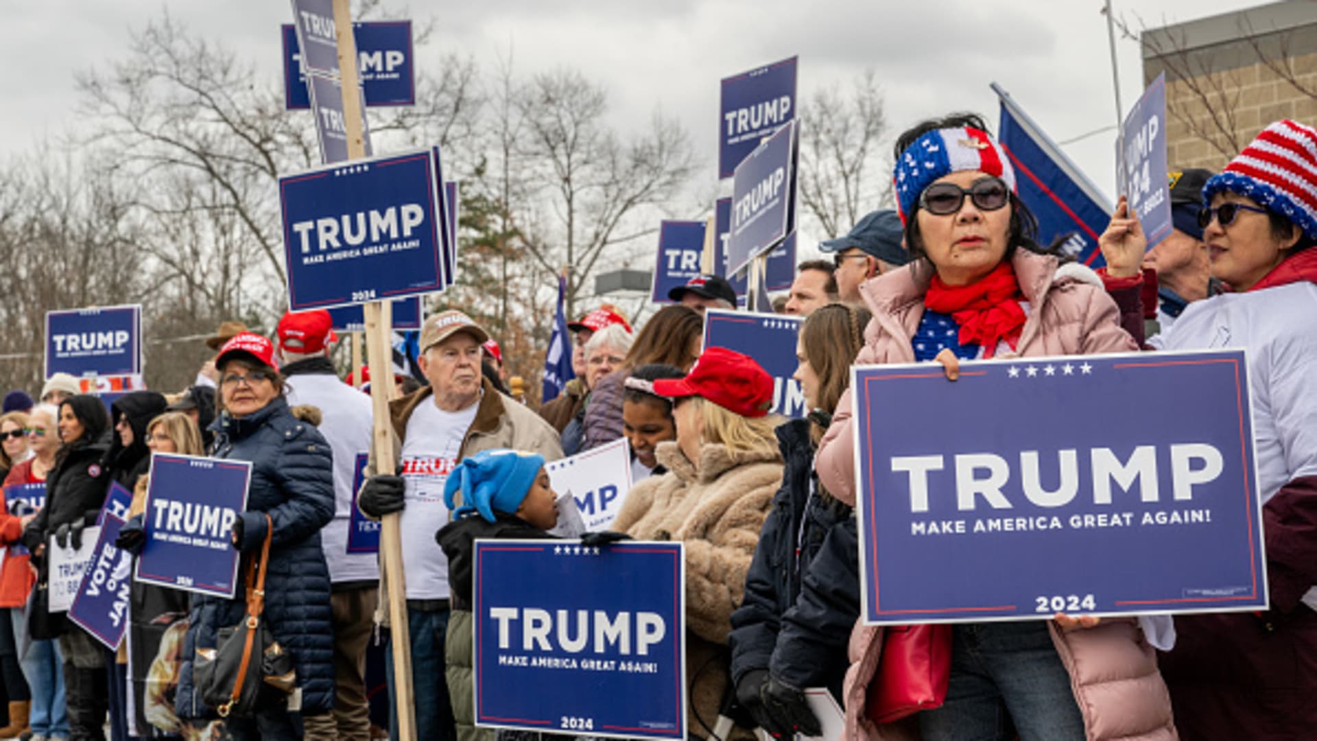 Trump supporters wait together ahead of Republican presidential candidate and former President Donald Trump's visit to the Londonderry High School polling station on January 23, 2024 in Londonderry, New Hampshire.