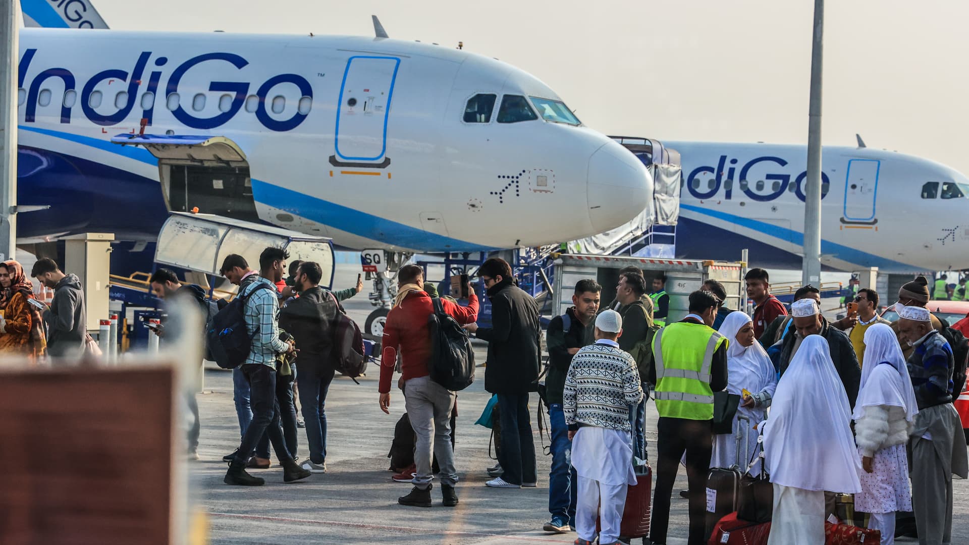 Kashmiri Umrah pilgrims boarding an IndiGo flight at the Delhi Airport in India on December 13, 2023.