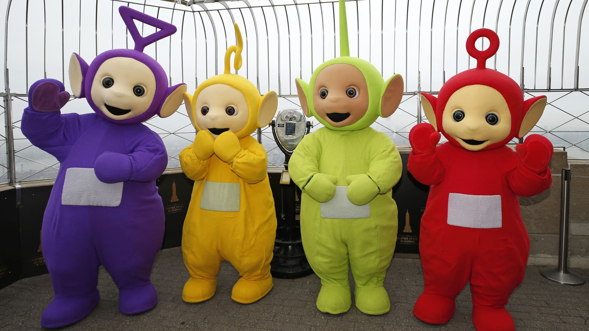 Tinky-Winky, Laa-Laa, Dipsy and Po pose for a photo as the Teletubbies celebrate their 25th anniversary with the Lighting of the Iconic Empire State Building on April 26, 2022 in New York City.