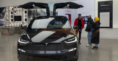 Tesla bull cuts price target and says EV maker may lose money in coming quarters