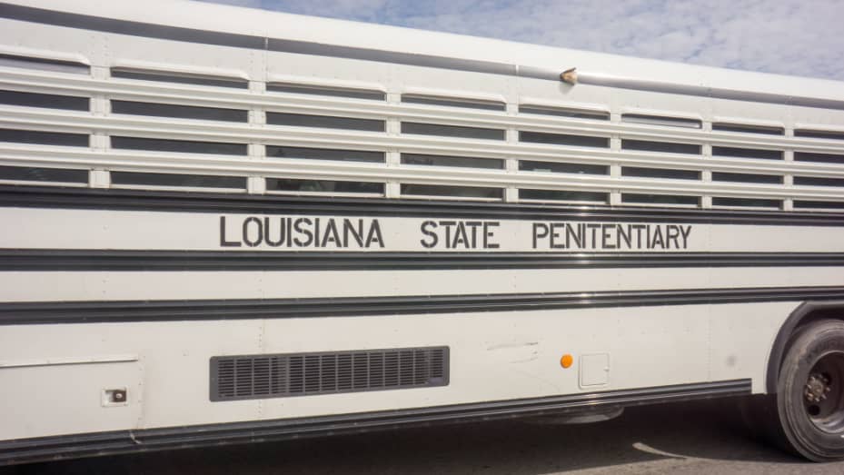 ANGOLA PRISON, LOUISIANA - OCTOBER 14, 2013: An offender transportation bus at Angola prison. The Louisiana State Penitentiary, also known as Angola, and nicknamed the "Alcatraz of the South" and "The Farm" is a maximum-security prison farm in Louisiana operated by the Louisiana Department of Public Safety & Corrections. It is named Angola after the former plantation that occupied this territory, which was named for the African country that was the origin of many enslaved Africans brought to Louisiana in