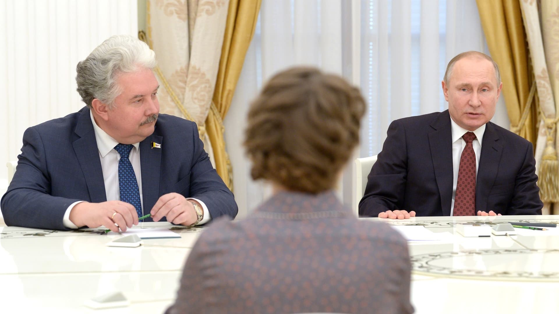 Sergei Baburin (rear L), now-former presidential candidate nominated by the Russian All People's Union Party and Russia's President Vladimir Putin (rear R) during a meeting at Moscow's Kremlin in Moscow in 2018. 