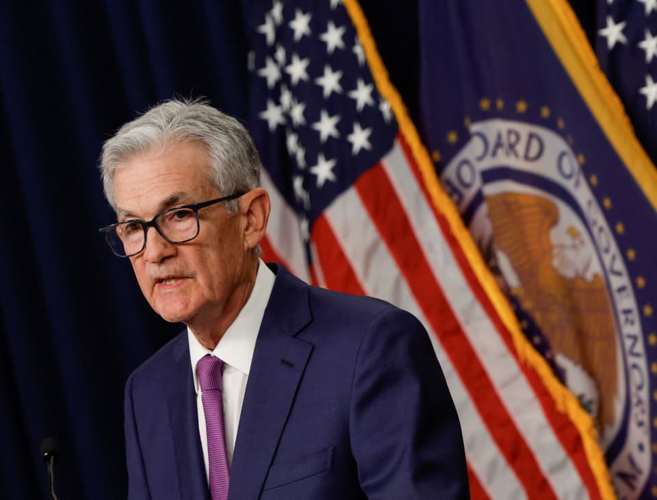 Fed holds rate steady and moves to ease the pace of balance sheet reduction