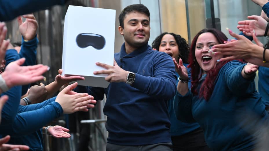 The first customer walks out of the Apple Store with his purchase of the Vision Pro headset in New York on February 2, 2024. The Vision Pro, the tech giant's $3,499 headset, is its first major release since the Apple Watch nine years ago. (Photo by ANGELA WEISS / AFP) (Photo by ANGELA WEISS/AFP via Getty Images)