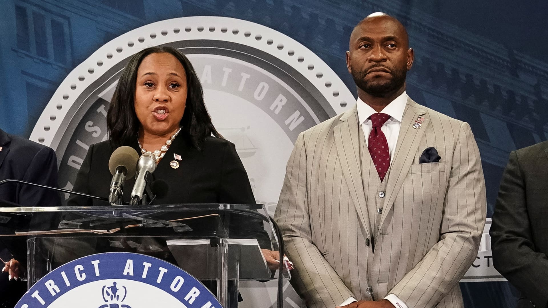 Fulton County District Attorney Fani Willis speaks at a press conference next to prosecutor Nathan Wade after a grand jury brought back indictments against former President Donald Trump and his allies in their attempt to overturn the state's 2020 election results, in Atlanta on Aug. 14, 2023.