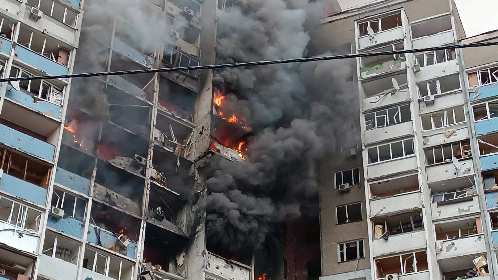 A fire caused by the falling fragments of a Russian missile rages in a block of flats in the Holosiivskyi district after the Russian missile attack on Wednesday morning, Kyiv. 