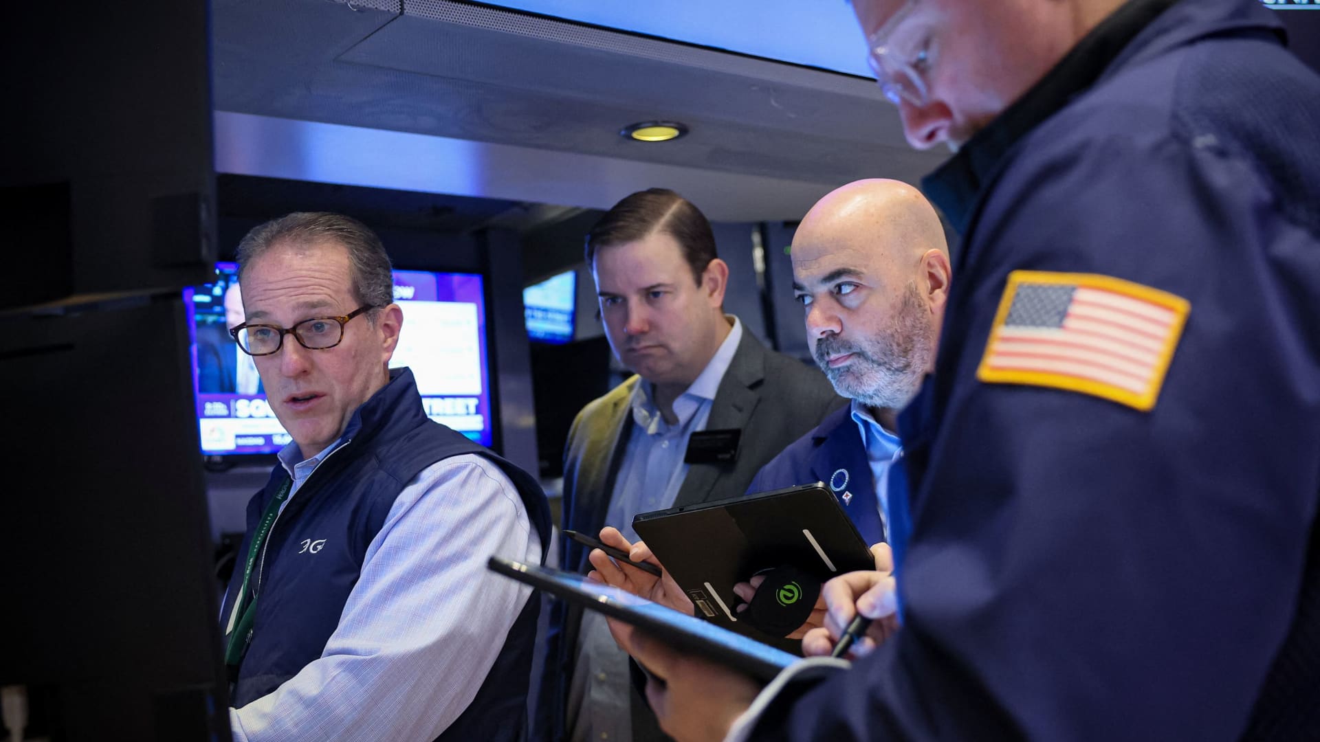 Traders work on the floor at the New York Stock Exchange on Feb. 7, 2024.