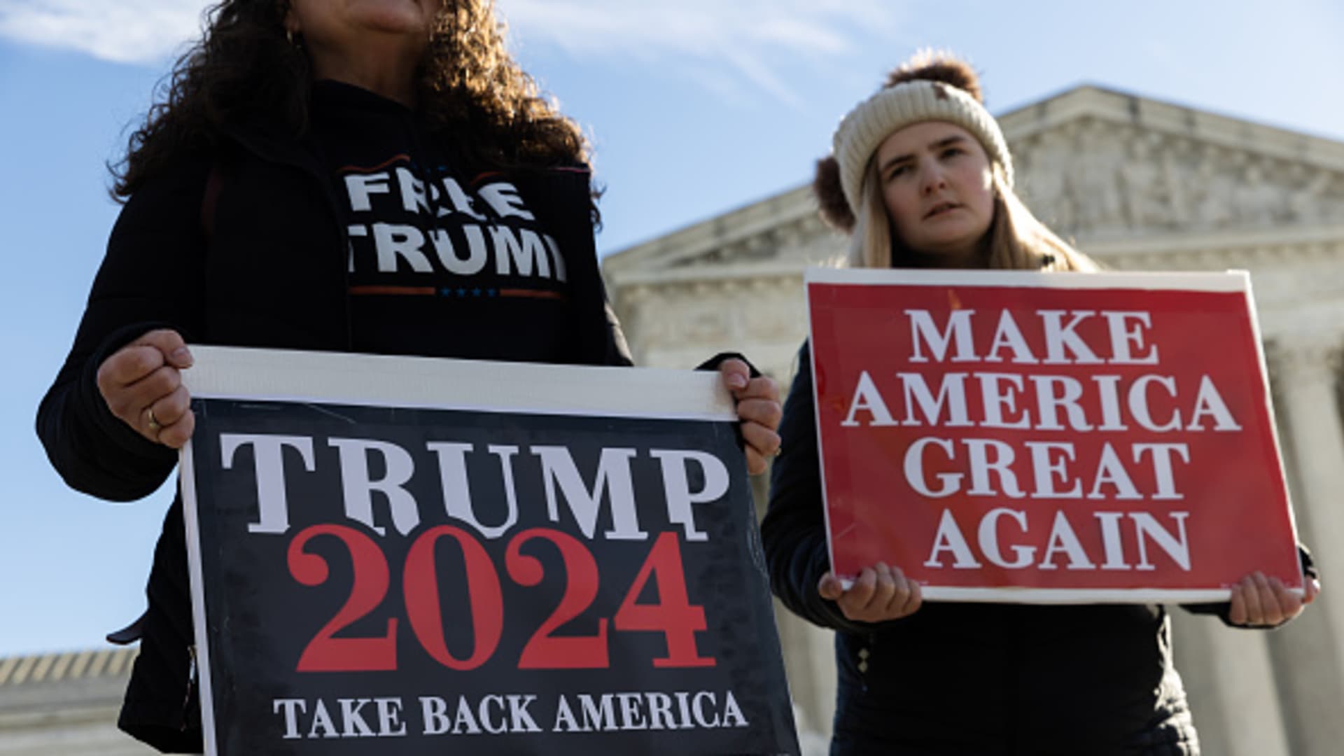 Protesters demonstrate outside of the U.S. Supreme Court on February 8, 2024 in Washington, DC. The court will hear oral arguments in a case on whether or not former President Trump can remain on the ballot in Colorado for the 2024 presidential election. 