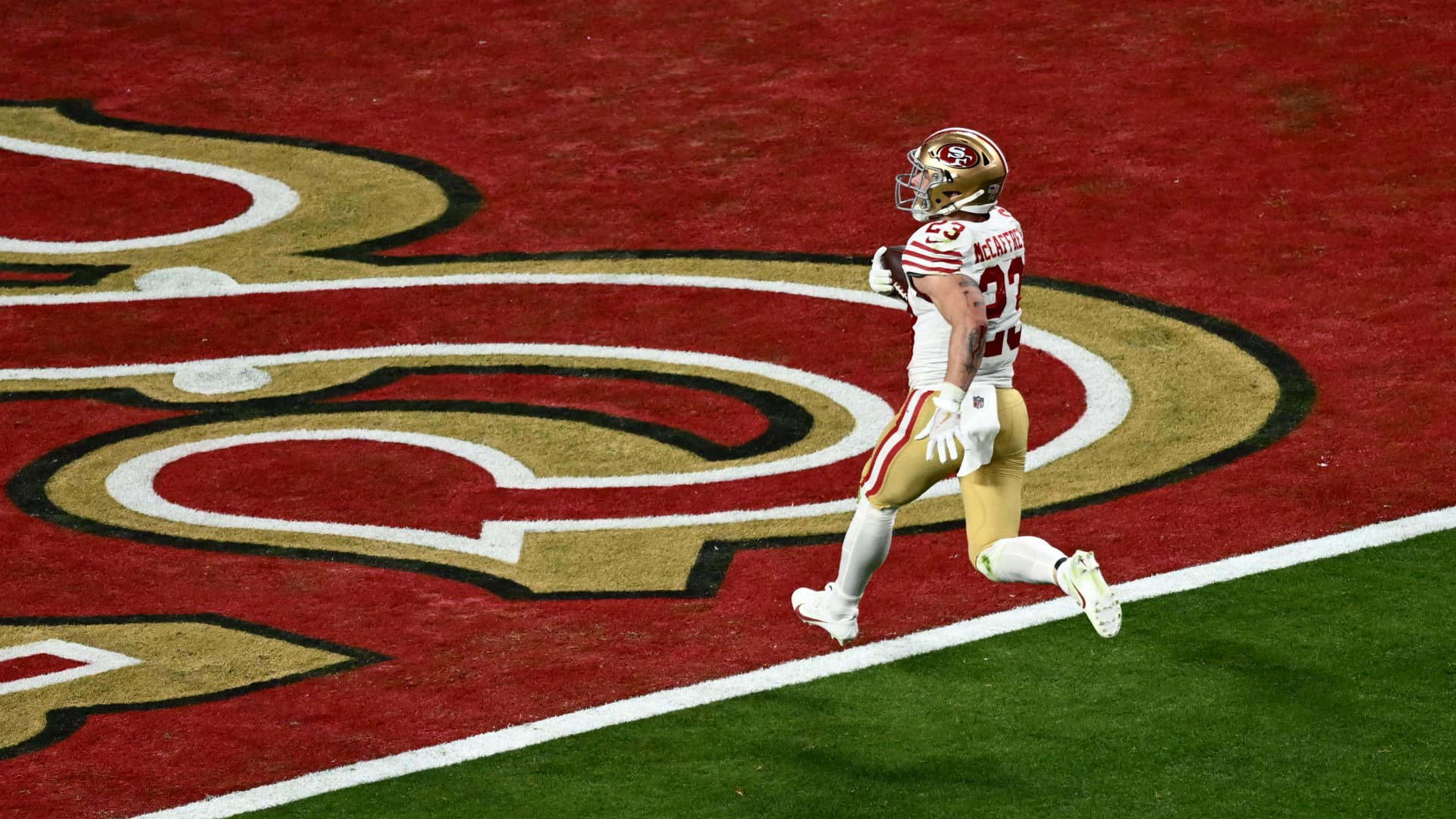 San Francisco 49ers' running back #23 Christian McCaffrey scores a touchdown during Super Bowl LVIII between the Kansas City Chiefs and the San Francisco 49ers at Allegiant Stadium in Las Vegas, Nevada, February 11, 2024. 