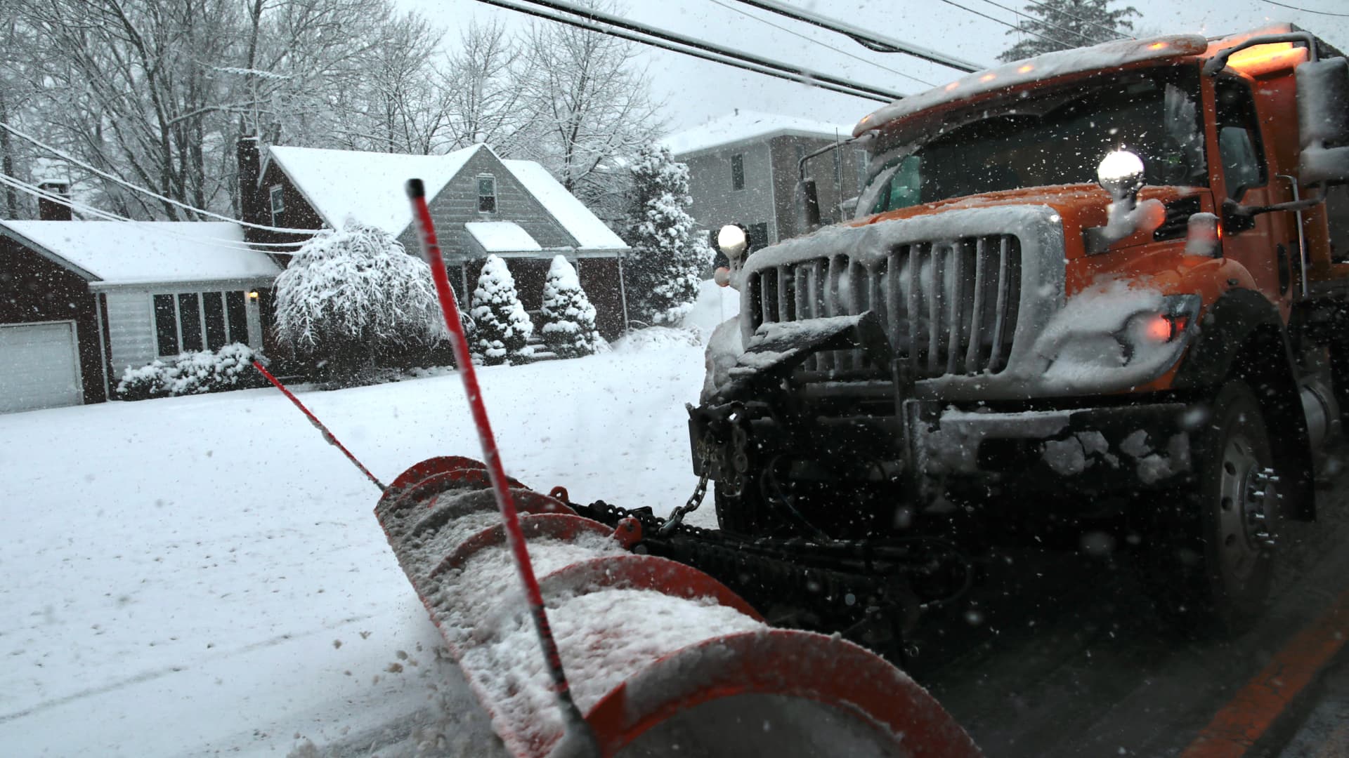A snowplow clears Main Street as snow falls in Tappan, New York, on February 10, 2024. 