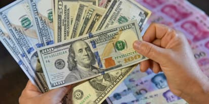 Dollar jumps on central bank divergence, euro hits five-month low