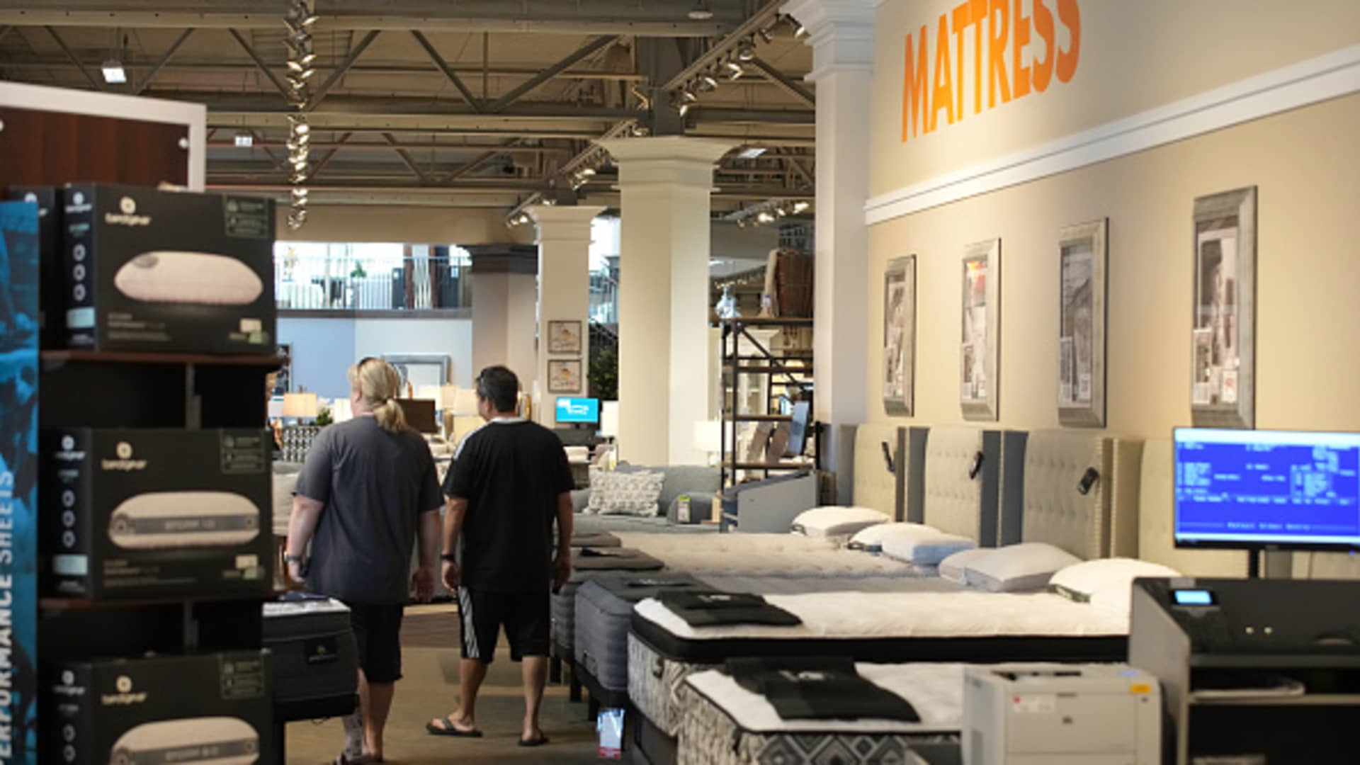 Customers shop at an RC Willey home furnishings store in Draper, Utah, Aug. 28, 2023.