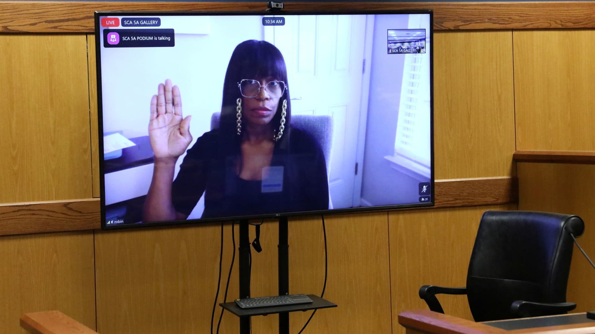 Witness Robin Yeartie is seen on a screen as she is sworn in during a hearing in the case of State of Georgia v. Donald John Trump at the Fulton County Courthouse in Atlanta, Georgia, U.S., February 15, 2024. 