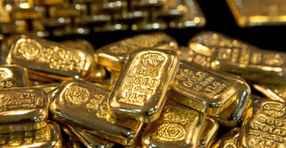 Gold at one-week high as soft dollar, Middle East turmoil lift demand