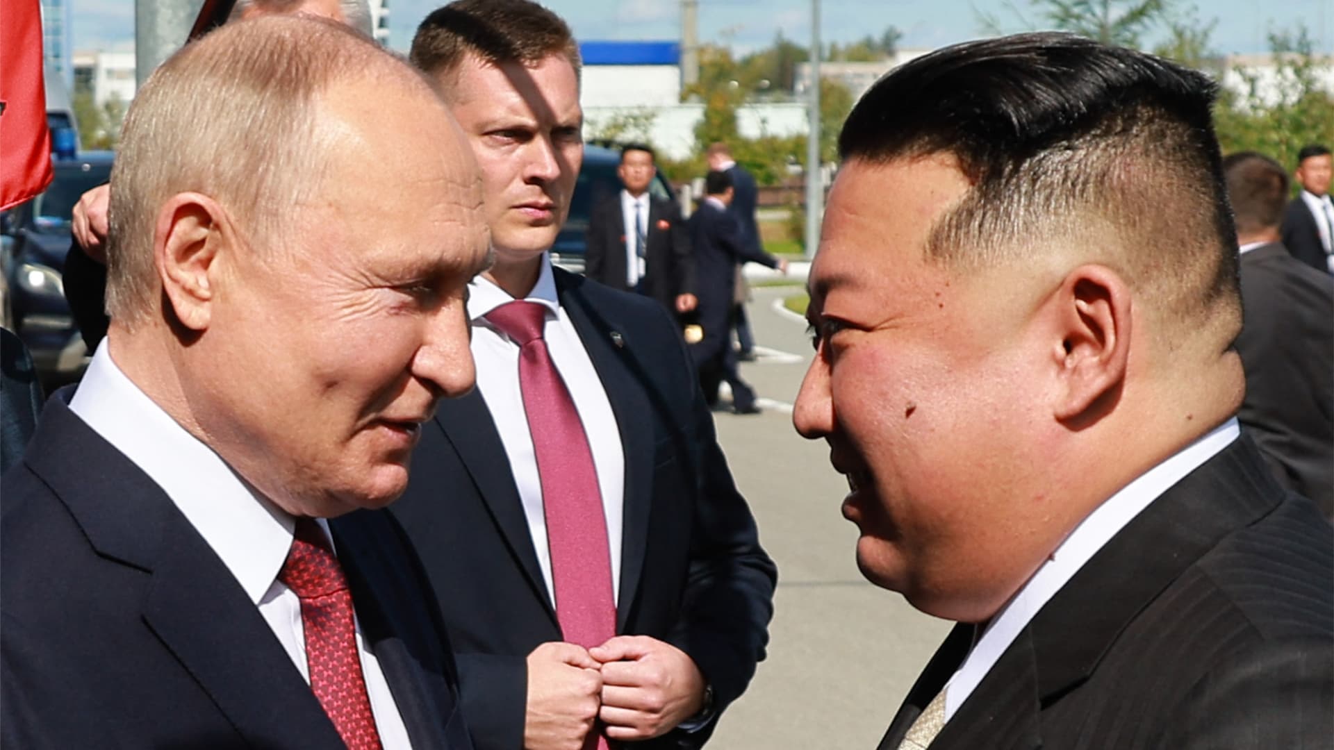 Russia's President Vladimir Putin (L) shakes hands with North Korea's leader Kim Jong Un during their meeting at the Vostochny Cosmodrome in Amur region on September 13, 2023. 