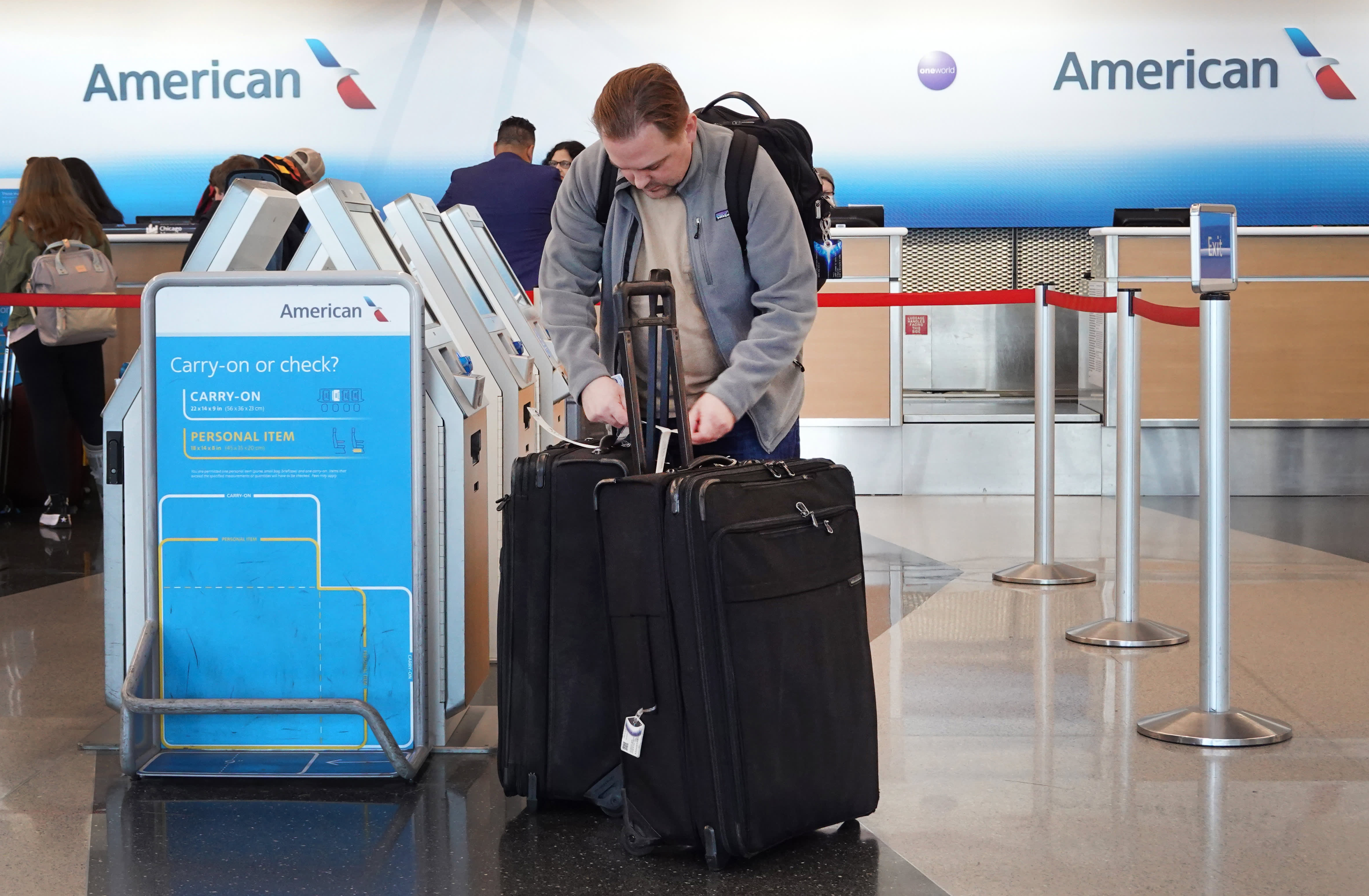 American Airways is elevating bag charges, capping mileage for journey company bookings