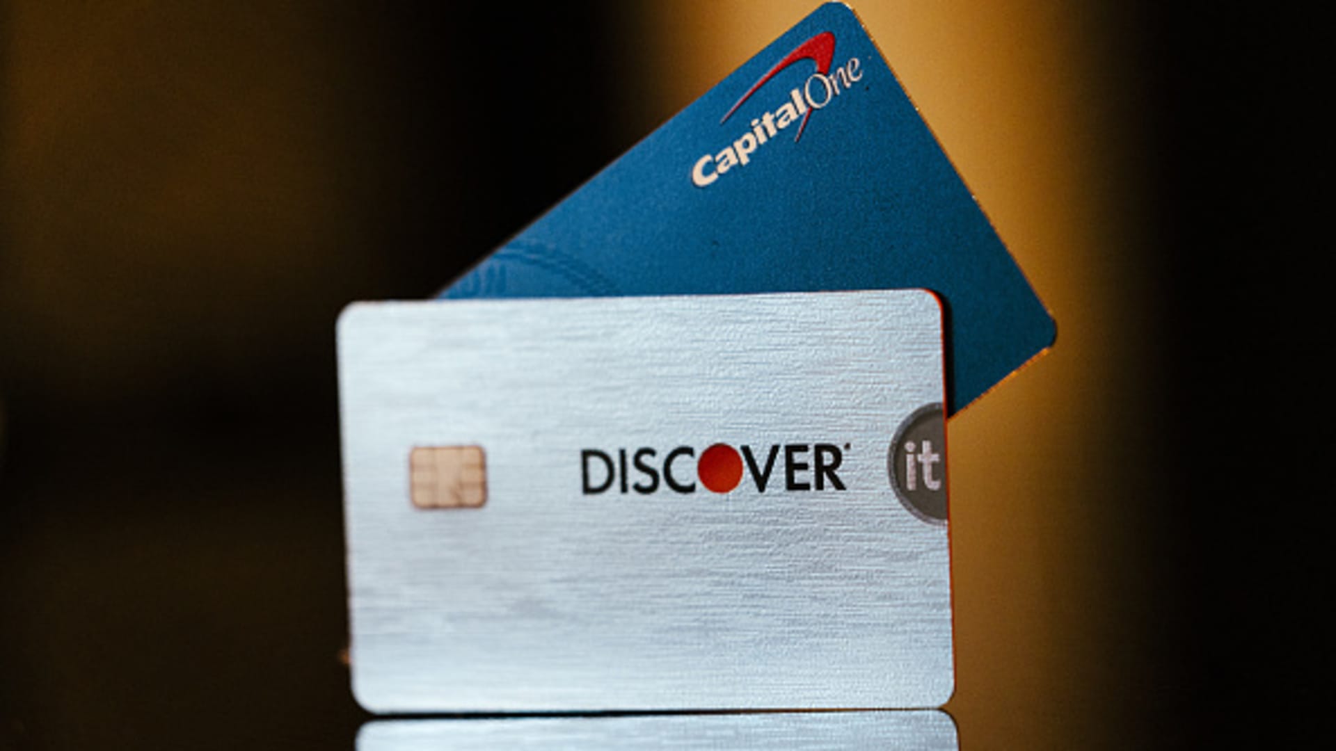 Capital One and Discover credit cards arranged in Germantown, New York, US, on Tuesday, Feb. 20, 2024. 