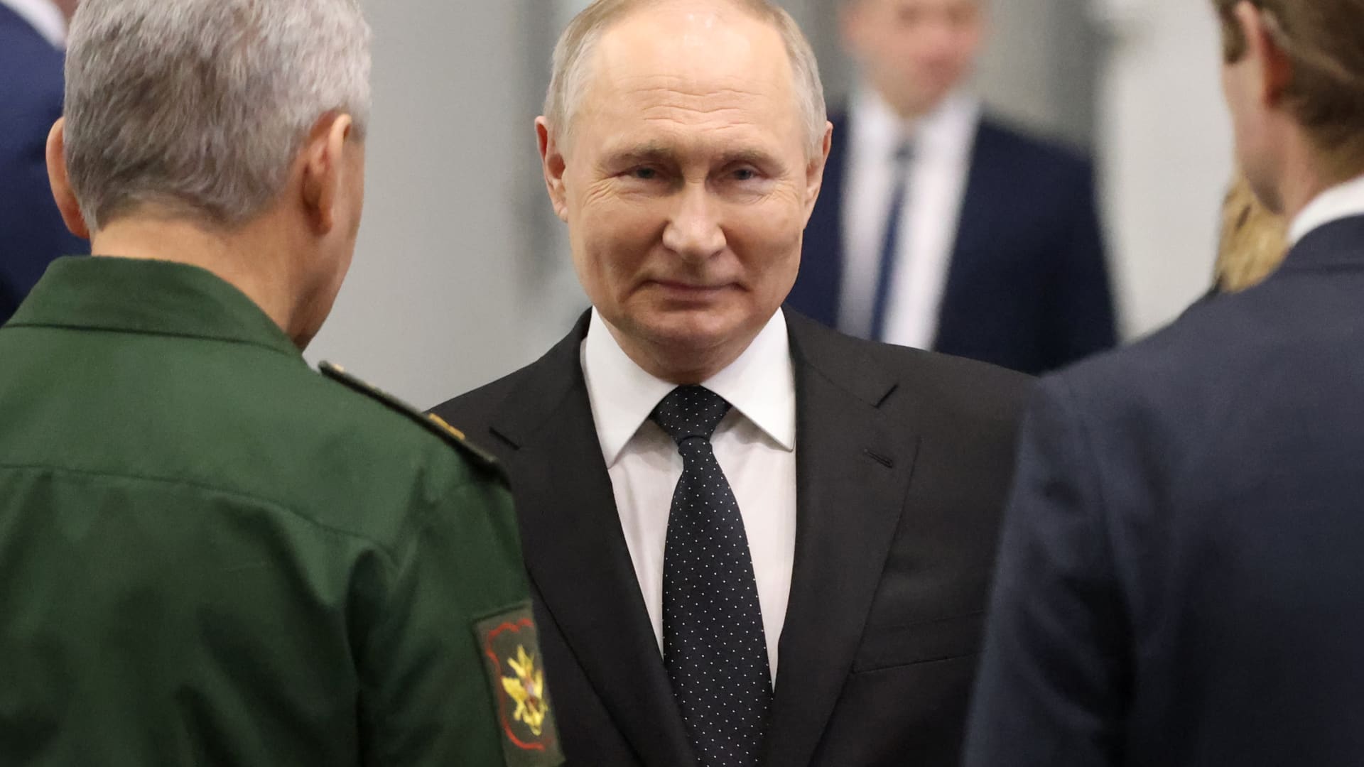 Russian President Vladimir Putin smiles while visiting an aviation plant on February 21, 2024, in Kazan, Russia. 