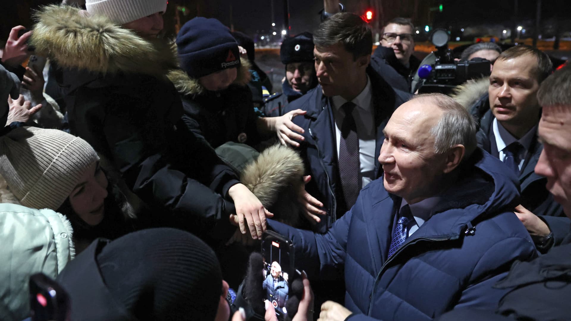In this pool photograph distributed by Russian state agency Sputnik, Russia's President Vladimir Putin meets with residents of the town of Tsivilsk in the Republic of Chuvashia on February 22, 2024.
