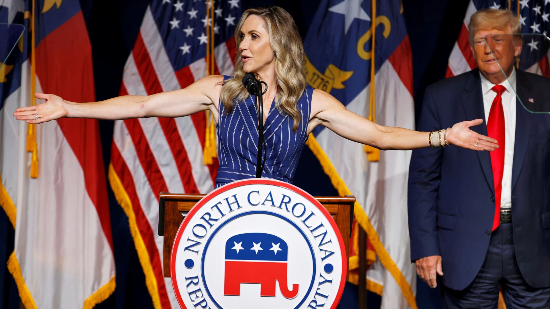 Lara Trump addresses the audience as her father-in-law, former U.S. President Donald Trump, looks on at the North Carolina GOP convention dinner in Greenville, North Carolina, U.S. June 5, 2021. 