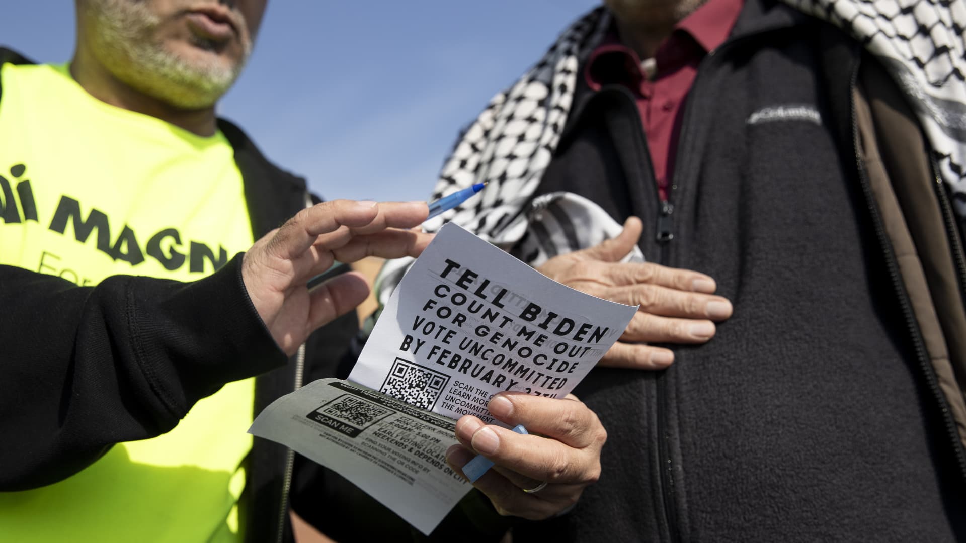 A man explains the importance of voting 'uncommited' as he hands out fliers outside the Islamic Center of Detroit to ask voters to vote 'uncommitted' in Michigan Primary elections on Tuesday, in Michigan, United States on February 26, 2024. 