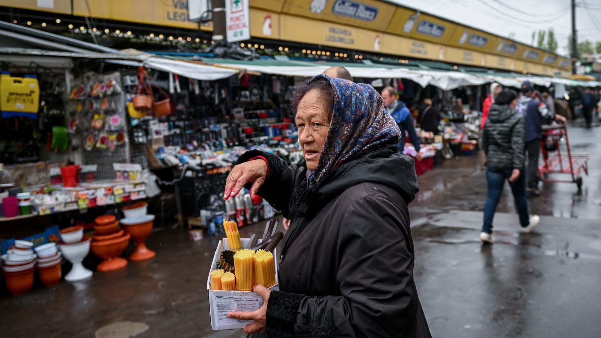 A woman selling candles and incense at the central market in Chisinau, Moldova, on April 29, 2022.
