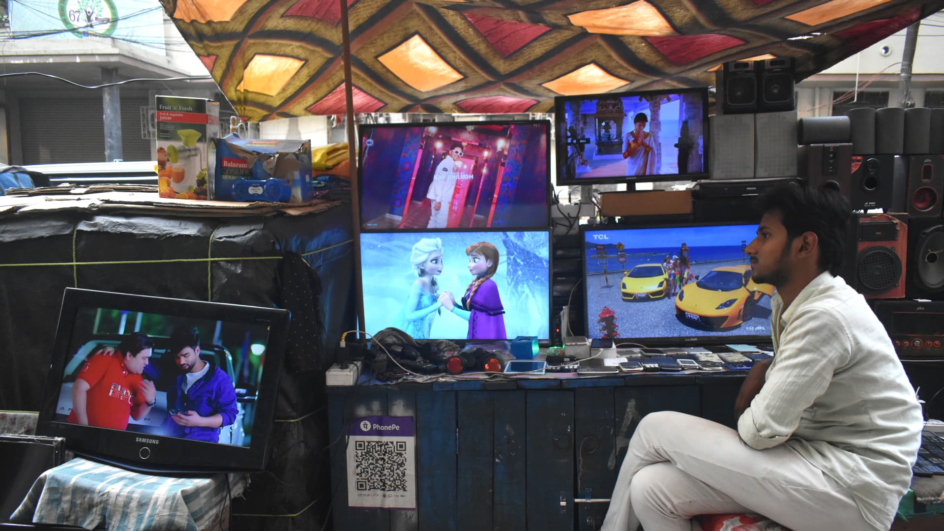 A person is selling second-hand LCD TV sets inside a second-hand electronics market in Kolkata, India, on February 26, 2024. (Photo by Sudipta Das/NurPhoto via Getty Images)
