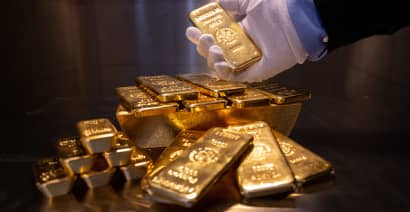 Gold hits 1-month high as dollar dips after U.S. PCE data